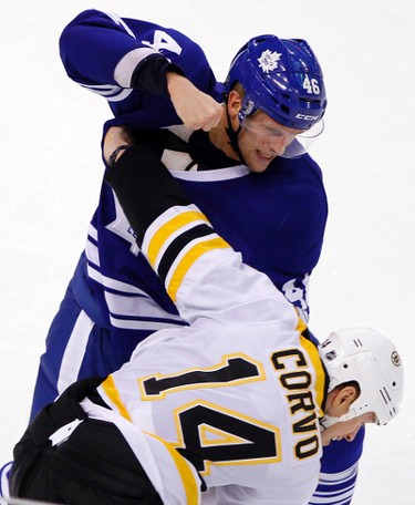 Toronto Maple Leafs right wing Joey Crabb (top) and Boston Bruins defenseman Joe Corvo fight in the third period of their NHL hockey game in Boston, Massachusetts December 3, 2011. (REUTERS/Brian Snyder)