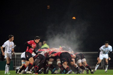 Lyon's and Montpellier's forwards compete in a scrum during the French Top 14 rugby union match  Lyon vs. Montpellier on November 30, 2011 in Lyon. (AFP PHOTO/PHILIPPE MERLE)