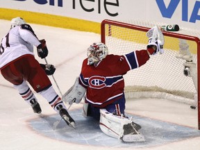 Blue Jackets captain Rick Nash scores the winning shootout goal against Canadiens goaltender Carey Price at the Bell Centre in Montreal, Que., Dec. 6, 2011. (CHRISTINNE MUSCHI/Reuters)
