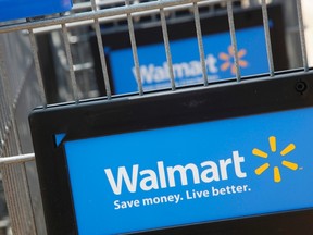 Shopping carts are seen outside a new Walmart Express store in Chicago in this July 26, 2011 file photograph.  (REUTERS/John Gress/Files)