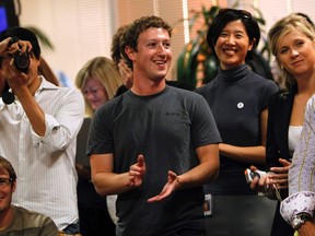 Facebook CEO Mark Zuckerberg applauds while unveiling the company's new location services feature called "Places" during a news conference with staff at the Facebook headquarters in Palo Alto, Calif., in this August 18, 2010 file photograph. REUTERS/Robert Galbraith/File