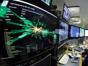 A graphic showing a collision at full power is pictured at the Compact Muon Solenoid (CMS) experience control room of the Large Hadron Collider (LHC) at the European Organization for Nuclear Research (CERN) in Meyrin, near Geneva in this file picture taken March 30, 2010. REUTERS/Denis Balibouse/Files
