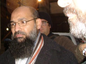 Mohammad Mahjoub, outside Federal courts in Toronto on Thursday, says he has been fighting false terrorism charges in Canada for 11 years. (TOM GODFREY/Toronto Sun)