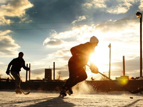 Hockey often makes for great photos, and this was no exception. The sun sets on a game of outdoor hockey at Brewer Park on Feb. 11, the day before CBC's annual Hockey Day in Canada. (Darren Brown/Ottawa Sun)