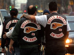 Hells Angels - Members of the Motorcycle Club the Hells Angels walk down King St. West in Toronto Saturday, January 12, 2002. (QMI Agency File Photo)