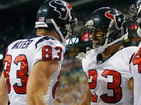 Houston Texans running back Arian Foster (R) smiles while celebrating a touchdown against the Indianapolis Colts with Texans wide receiver Kevin Walter last Thursday. The Texans eventually lost, their second defeat in a row. (REUTERS)