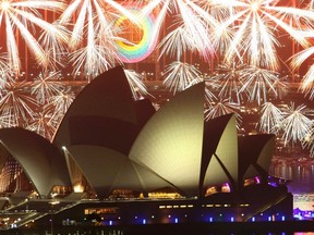 Fireworks explode over the Sydney Opera House during a pyrotechnic show to celebrate the New Year January 1, 2012. (REUTERS/Daniel Munoz)
