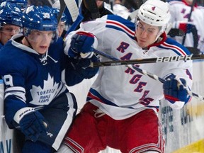 Rangers defenceman Michael Del Zotto (right) was one of three players fined by the NHL on Saturday, Dec. 31, 2011. (REUTERS/Ray Stubblebine)