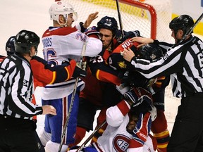Montreal Canadiens' P.K. Subban (bottom), teammate Josh Gorges (26), Florida Panthers' Mike Weaver (43) and teammate Erik Gudbranson (44) fight at the end of the first period of their NHL hockey game in Sunrise, Florida December 31, 2011. (REUTERS/Doug Murray)