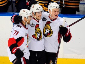 Ottawa Senators left wing Nick Foligno, right wing Bobby Butler and right wing Chris Neil (L-R) celebrate a shootout victory against the Buffalo Sabres, at the end of their NHL hockey game in Buffalo, New York December 31, 2011. Butler scored the game winner.  (REUTERS/Doug Benz)