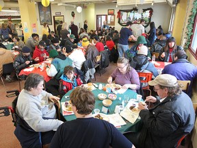 People enjoy the annual Christmas Eve dinner at Siloam Mission in Winnipeg Saturday December 24, 2011. The mission expected to serve approximately 700 guests.
BRIAN DONOGH/WINNIPEG SUN/QMI AGENCY