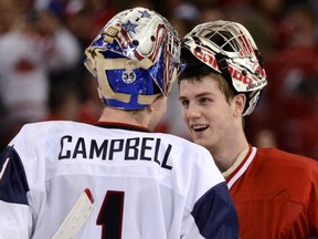 Canada's goalie Scott Wedgewood (R) shakes hands with Team USA's goalie Jack Campbell after Canada defeated Team USA at the 2012 IIHF U20 World Junior Hockey Championships in Edmonton, Alberta, December 31, 2011. (REUTERS/Todd Korol)