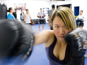 Reporter Jenny Yuen learns some Muay Thai skills at Toronto BJJ,  813 Bloor St. W. (DAVE THOMAS, Toronto Sun)