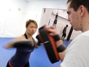 Toronto Sun reporter Jenny Yuen learns some Muay Thai moves at Toronto BJJ on Bloor St. W. (DAVE THOMAS, Toronto Sun)