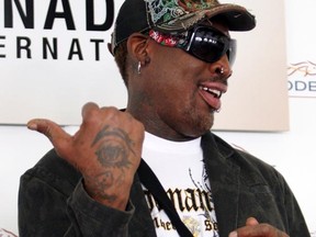 Former NBA superstar Dennis Rodman will reportedly coach a "topless" women's team which could compete in a charity game against a squad coached by another ex-NBA star, Spud Webb. (Veronica Henri/QMI Agency)