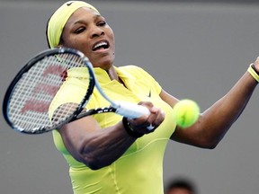 Serena Williams returns a shot to Chanelle Scheepers during their match at the Brisbane International on Monday, Jan. 2, 2012. (REUTERS/Daniel Munoz)