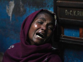 A family member weeps for her relative, who died after consuming bootleg liquor, inside a hospital at Diamond Harbour, a town about 50 km south of West Bengal's capital Kolkata on December 15, 2011. India Today reports another 16 people died over the weekend after consuming homemade liquor in the Krishna district of Andhra Pradesh. (REUTERS FILES/Rupak De Chowdhuri)