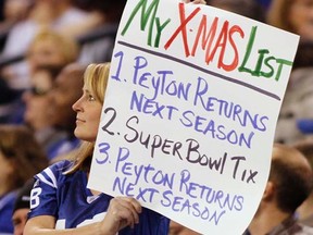 A Colts fan holds up a sign during a game against the Texans in Indianapolis on Dec. 22, 2011. (REUTERS/Brent Smith)