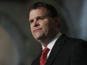 Foreign Affairs Minister John Baird delivers a statement in Ottawa on December 23, 2011. (CHRIS ROUSSAKIS/QMI Agency)
