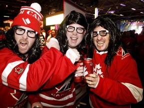 Jeff Macdonald, Bernie Macdonald and Jamie Mcaulay do their best Hanson brothers impersonation prior to Canada facing the USA at the World Junior Hockey Championship in Edmonton, Alta., Dec. 31, 2011. (TOM BRAID/QMI Agency)