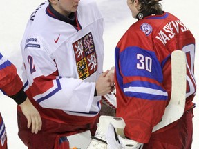 Czech goaltender Petr Mrazek (left) and Russia goaltender Andrei Vasilevski congratulate each other after their World Junior Hockey Championship quarterfinal game at the Scotiabank Saddledome in Calgary, Alta., Jan. 2, 2012. (MIKE DREW/QMI Agency)