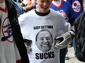 A boy wears a T-shirt showing NHL Commissioner Gary Bettman as hockey fans celebrate the return of NHL hockey at the Forks Market May 31, 2011. (REUTERS)