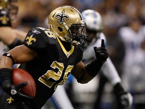 Saints running back Mark Ingram rushes against the Lions in the first quarter at the Mercedes-Benz Superdome in New Orleans, La., Dec. 4, 2011. (CHRIS GRAYTHEN/Getty Images/AFP)