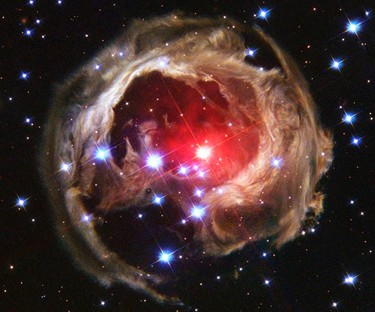 Star V838 Monocerotis's (V838 Mon) light echo, which is about six light years in diameter, is seen from the Hubble Space Telescope in this February 2004 handout photo released by NASA on December 4, 2011. V838 Mon lies about 20,000 light years away toward the constellation of Monoceros the unicorn. It became the brightest star in the Milky Way Galaxy in January 2002 when its outer surface greatly expanded suddenly. (NASA, ESA, H. E. Bond (STScI)/Handout)