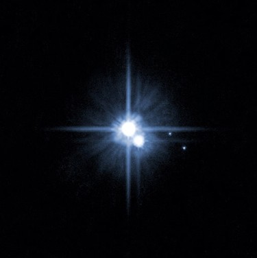 This image provided by NASA on Feb. 22, 2006 from NASA's Hubble Space Telescope shows two new moons around Pluto. (NASA/Handout)