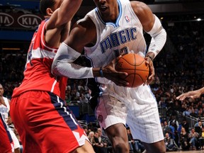Magic centre Dwight Howard drives to the basket during the game against the Wizards at Amway Center in Orlando, Fla., Jan. 4, 2012. (FERNANDO MEDINA/NBAE via Getty Images/AFP)