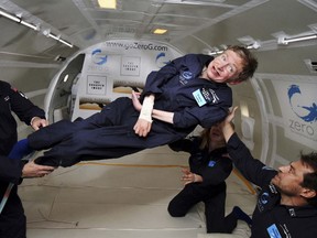 British physicist Stephen Hawking is assisted as he floats during a ZERO-G flight aboard a modified Boeing 727 after taking off from the Kennedy Space Center in Cape Canaveral, Florida April 26, 2007. REUTERS/Zero-Gravity Corporation/Handout