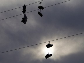 Shoes hang on a power line, an indicator of drug activity, in the Samson Cree First Nation Townsite in Hobbema Jan. 5. The Samson Cree First Nation just passed a bylaw allowing residents to ban gang members. AMBER BRACKEN/EDMONTON SUN