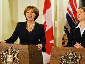 British Columbia Premier Christy Clark (L) and Alberta Premier Alison Redford address the media after a meeting in Edmonton December 13, 2011.   REUTERS/Dan Riedlhuber