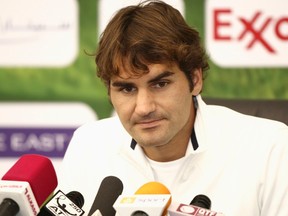 Roger Federer of Switzerland speaks at a news conference after he retired injured before his semi-final match against Jo-Wilfried Tsonga of France during the ATP Qatar Open tennis tournament in Doha January 6, 2012. (REUTERS/Fadi Al-Assaad)