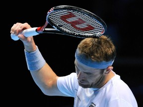 Mardy Fish of the U.S. reacts during his singles tennis match against Jo-Wilfried Tsonga of France at the ATP World Tour Finals at the O2 Arena in London November 22, 2011. (REUTERS/Toby Melville)