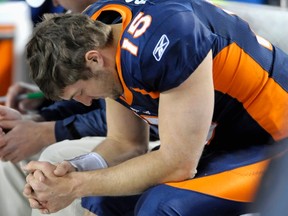 Denver Broncos' Tim Tebow sits on the bench during their NFL football game against the Kansas City Chiefs in Denver, Colorado January 1, 2012. (REUTERS/Mark Leffingwell)