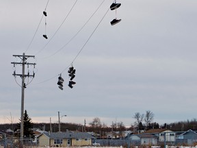 Shoes hang on a power line, an indicator of drug activity, in the Samson Cree First Nation Townsite in Hobbema Thursday, Jan. 5. The Samson Cree First Nation just passed a bylaw allowing residents to ban gang members. AMBER BRACKEN/EDMONTON SUN