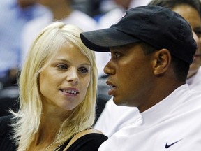 Tiger Woods and his ex-wife Elin Nordegren watch Game 4 of the NBA Finals basketball game in Orlando, Fla., in this June 11, 2009 file photo.  REUTERS/Hans Deryk