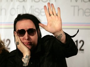 Musician Marilyn Manson speaks during a news conference about his art exhibit "The Path of Misery" at the San Idefonso museum in Mexico City November 2, 2011. REUTERS/Bernardo Montoya