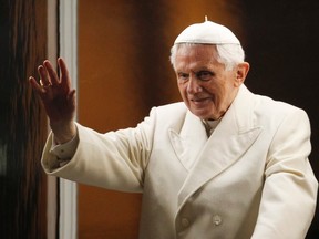 Pope Benedict XVI waves as he arrives to bless the traditional Crib in St Peter's Square at the Vatican December 31, 2011, after leading the First Vespers and Te Deum prayers in Saint Peter's Basilica. (REUTERS/Giampiero Sposito)