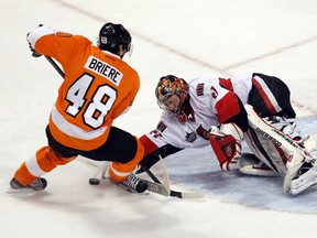 Ottawa Senators goalie Craig Anderson (41) makes a save on a shot by the Philadelphia Flyers center Danny Briere (48) during the first period of their NHL ice hockey game in Philadelphia, January 7, 2012. REUTERS/Tim Shaffer