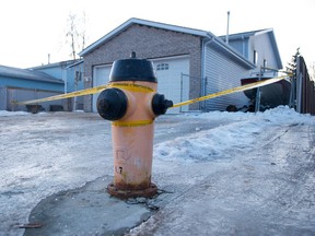 Emergency services, including police and fire, were called to a house in northeast Edmonton, Alberta, after a woman in her 60s was found dead inside the home in a bathroom. Her husband was taken to hospital in critical conditions with bad burns. IAN KUCERAK/EDMONTON SUN/QMI AGENCY