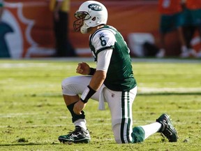 Jets QB Mark Sanchez gets up after throwing an interception during second half action against the Dolphins in Miami on Jan. 1, 2012. (REUTERS/Joe Skipper)