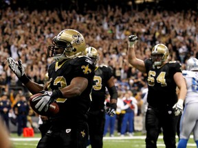 New Orleans Saints running back Darren Sproles celebrates scoring in the second quarter against the Detroit Lions during their NFC wild-card game at the Superdome on Saturday night. New Orleans won 45-28.