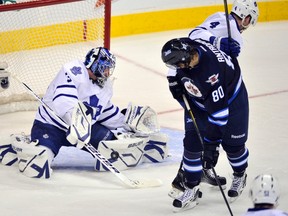 Toronto Maple Leafs goaltender James Reimer makes a save on Winnipeg Jets' Nik Antropov (80) during the first period of their NHL hockey game in Winnipeg December 31, 2011. (FRED GREENSLADE/Reuters)