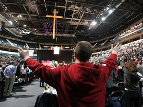 Winnipegger Kirt Cameron takes part in the One Heart Winnipeg Christian church service at the MTS Centre on Sun., Jan. 8, 2012. Sixty-two Winnipeg-area churches took part in the service. Cameron regularly attends church service at The Meeting Place.
JASON HALSTEAD/WINNIPEG SUN QMI AGENCY