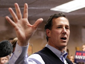 Republican presidential candidate Rick Santorum campaigns at The Daily Grind in Sioux City, Iowa, January 1, 2012. (REUTERS/John Gress)