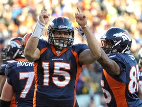 Denver Broncos quarterback Tim Tebow (L) celebrates with teammate Virgil Green after scoring a touchdown during the second quarter of the NFL AFC wildcard playoff football game against the Pittsburgh Steelers in Denver, Colorado, January 8, 2012. (REUTERS/Mark Leffingwell)