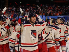 Mike Rupp and the New York Rangers celebrate after defeating the Flyers by a score of 3-2 during the 2012 Bridgestone NHL Winter Classic at Citizens Bank Park. (AFP)