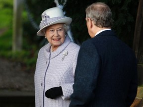 Britain's Queen Elizabeth and Prince Edward arrive for a Christmas Day service at St Mary Magdalene Church on the Royal estate at Sandringham, Norfolk in east England December 25, 2011. REUTERS/Suzanne Plunkett